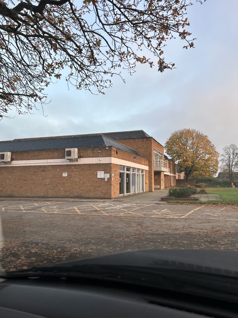 The low brick building and car park where Moore's Paws is based, in Cheltenham